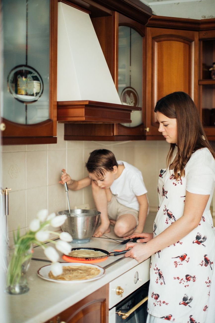 A mother and her child learning together at home — the heart of the homeschool community