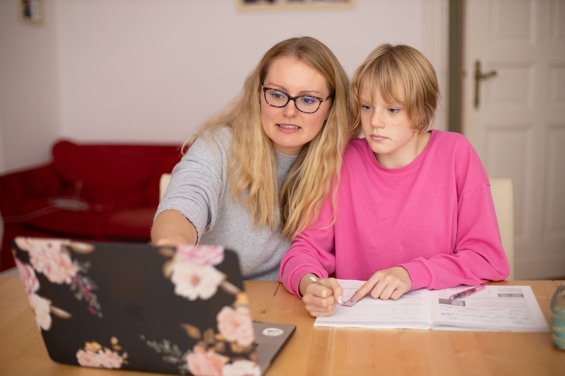 A mother and child engaged in learning at a desk — the kind of real educator Schoolhouse Studio builds websites for